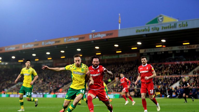 Marco Stiepermann of Norwich City and Danny Fox of Nottingham Forest compete for the ball during the Sky Bet Championship match between Norwich City and Nottingham Forest at Carrow Road on December 26, 2018 in Norwich, England