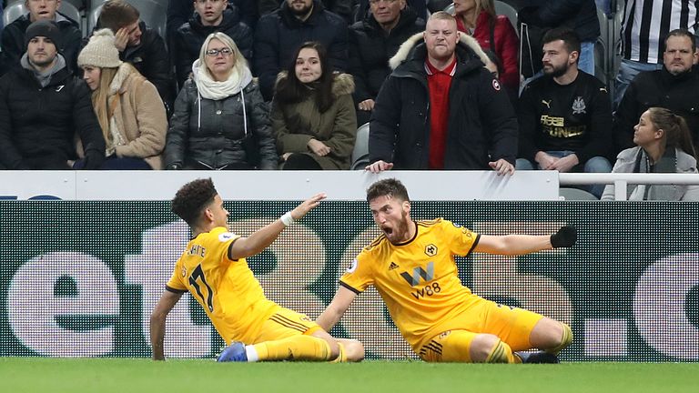 Wolverhampton Wanderers' Matt Doherty (right) celebrates scoring his side's second goal of the game during the Premier League match at St James' Park, Newcastle.