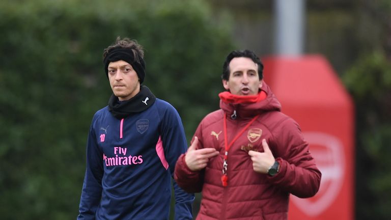 Arsenal&#39;s Mesut Ozil and head coach Unai Emery during a training session at London Colney