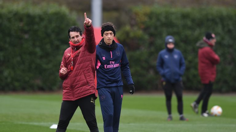 Arsenal&#39;s Mesut Ozil and head coach Unai Emery during a training session at London Colney