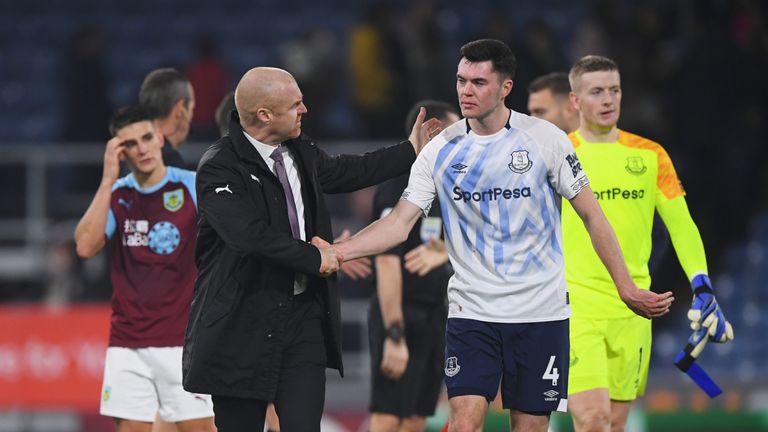 Dyche shakes the hand of former Burnley defender Michael Keane