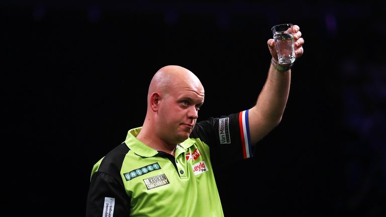 Michael van Gerwen of The Netherlands celebrates beating Rob Cross of Great Britain in their semi-final at the Betway Premier League Darts Play-Offs at The O2 Arena on May 17, 2018 in London, England. 
