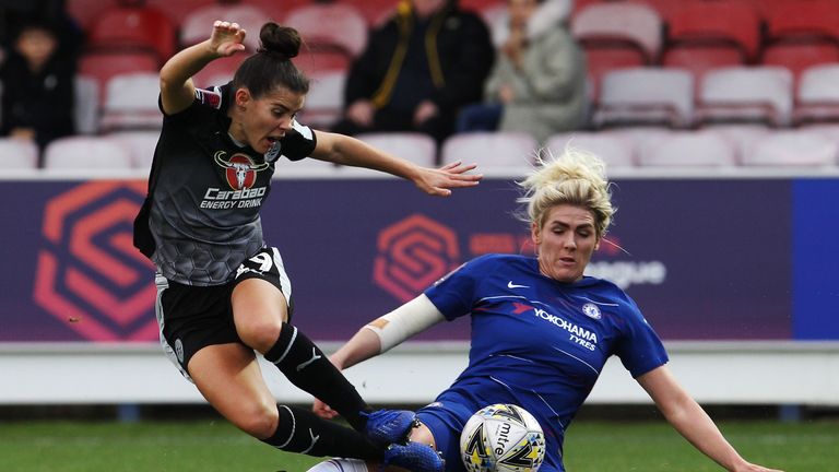 Millie Bright slides in on Reading's Brooke Chaplen in their 2-0 win