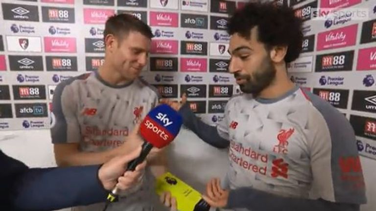 Mo Salah gives his MOTM award to James Milner after the midfielder's 500th Premier League appearance