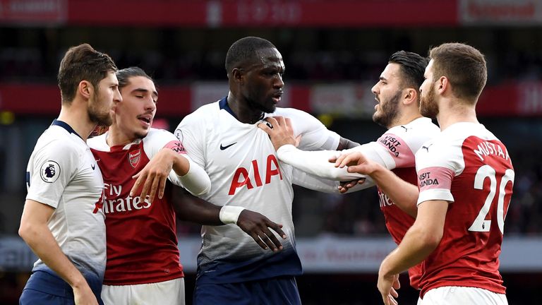 Moussa Sissoko and Sead Kolasinac clash during the north London derby