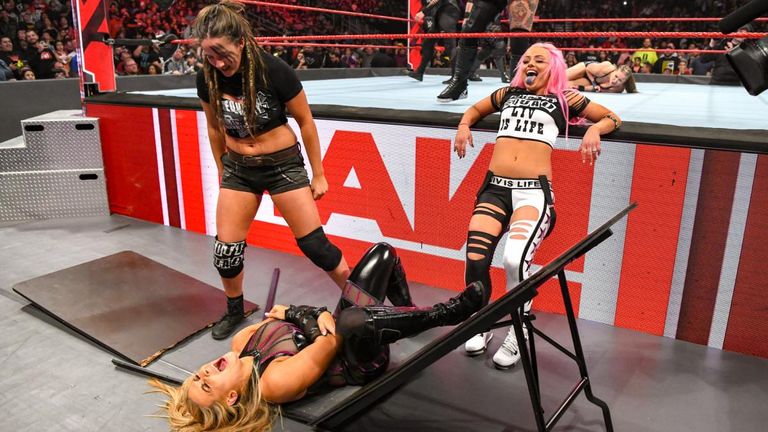 Natalya's night ended early thanks to a vicious table attack by the Riott Squad
