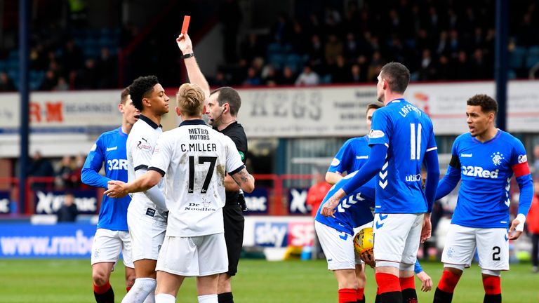 Dundee's Nathan Ralph is red carded following a late tackle on Rangers' Daniel Candeias