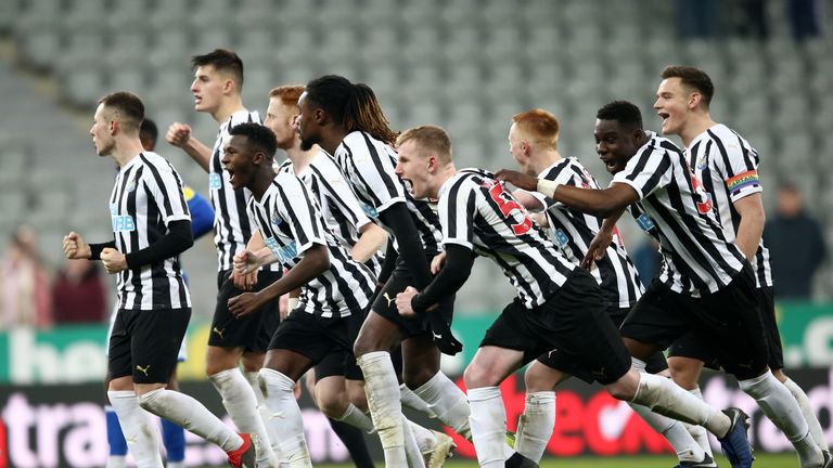 Newcastle United players celebrate victory in the penalty shoot out during the Checkatrade trophy match between Newcastle United U23 and Macclesfield Town at St. James Park on December 4, 2018 in Newcastle upon Tyne, England.