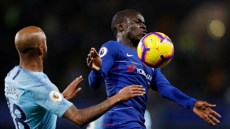 N'Golo Kante chests the ball under pressure from Fabian Delph