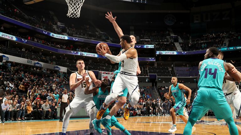Jamal Murray of the Denver Nuggets passes the ball against the Charlotte Hornets