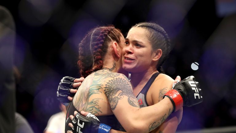 Cris Cyborg of Brazil (left) hugs Amanda Nunes of Brazil (right) after being defeated by TKO