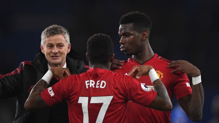 Ole Gunnar Solskjaer, Interim Manager of Manchester United celebrates with Fred and Paul Pogba after the Premier League match between Cardiff City and Manchester United at Cardiff City Stadium on December 22, 2018 in Cardiff, United Kingdom