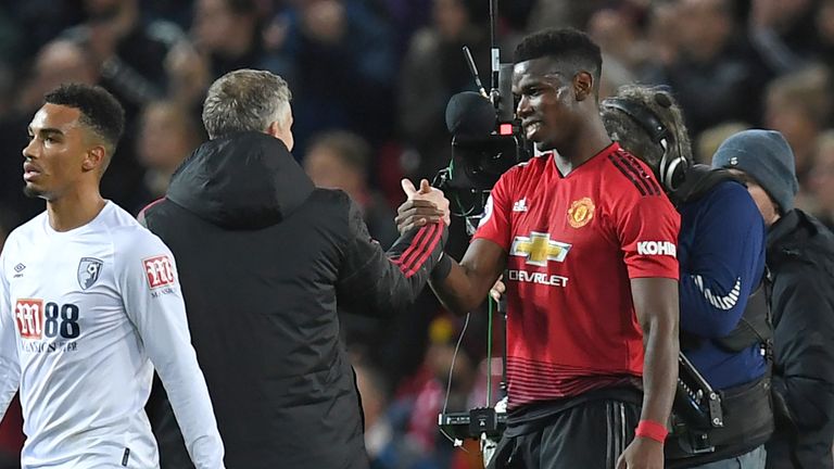 Manchester United caretaker manager Ole Gunnar Solskjaer shakes hands with Paul Pogba at the final whistle