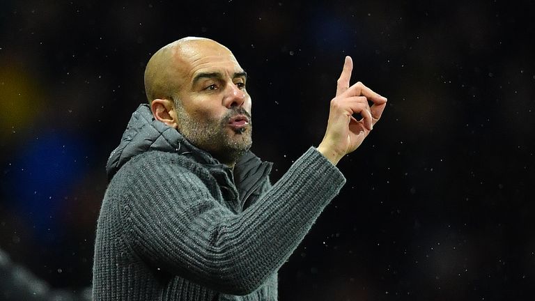 Pep Guardiola gestures during the match at Vicarage Road