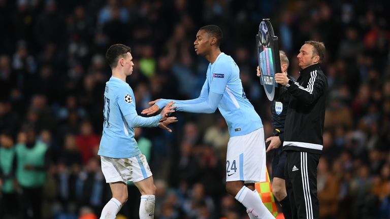 Phil Foden of Manchester City shakes hands with Tosin Adarabioyo