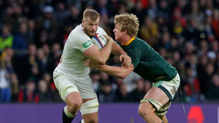 Pieter-Steph du Toit of South Africa tackles George Kruise of England at Twickenham on 3 November 2018