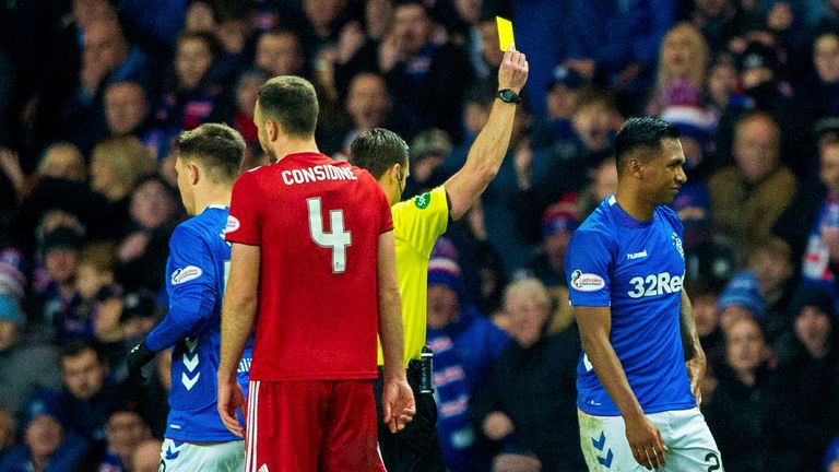 Rangers' Alfredo Morelos receives a yellow card from referee Steven McLean