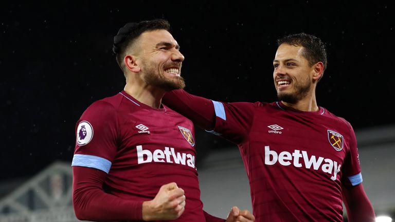 Robert Snodgrass celebrates his goal with Javier Hernandez