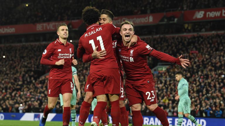 Roberto Firmino celebrates his third goal with Mohamed Salah and Xherdan Shaqiri