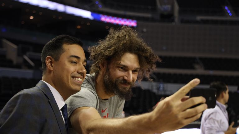 Robin Lopez of the Chicago Bulls takes a selfie with a media member during practice ahead of the NBA Mexico Games 2018 