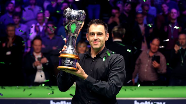 Ronnie O'Sullivan with the trophy after winning the Betway UK Championship at The York Barbican