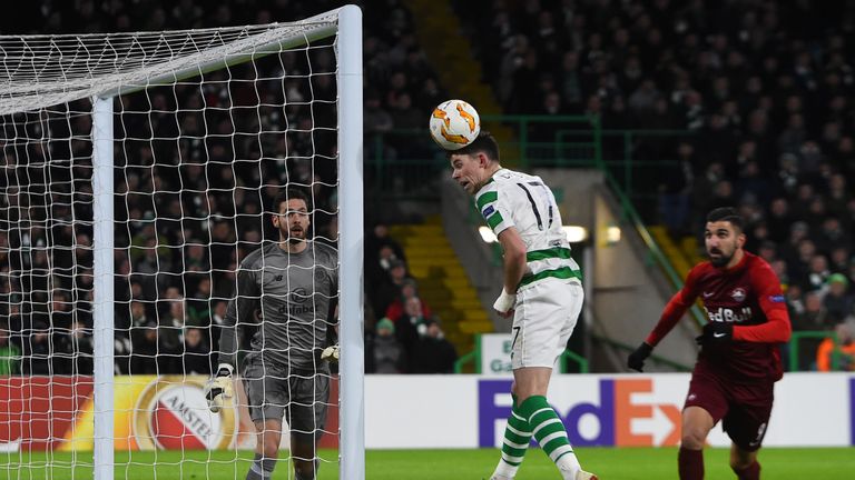 Ryan Christie heads clear after Salzburg hit the woodwork in the first half