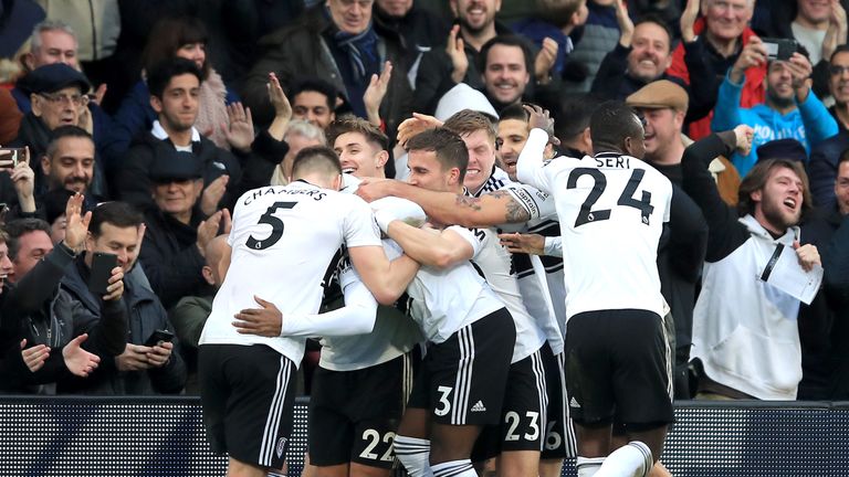 Ryan Sessegnon is mobbed by team-mates after Fulham take the lead