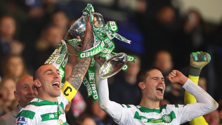 Scott Brown and Mikael Lustig lift the Scottish League Cup after Celtic's 1-0 win over Aberdeen