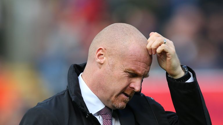 Sean Dyche, Manager of Burnley scratches his head prior to the Premier League match between Burnley FC and Huddersfield Town at Turf Moor on October 6, 2018 in Burnley, United Kingdom.
