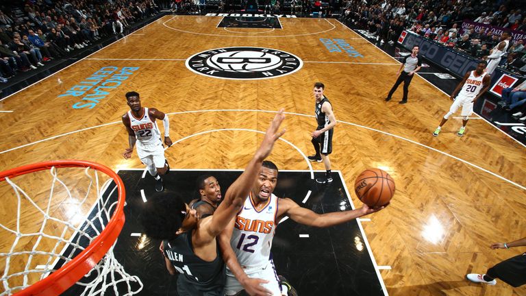 BROOKLYN, NY - DECEMBER 23: T.J. Warren #12 of the Phoenix Suns shoots the ball against the Brooklyn Nets on December 23, 2018 at Barclays Center in Brooklyn, New York. NOTE TO USER: User expressly acknowledges and agrees that, by downloading and or using this Photograph, user is consenting to the terms and conditions of the Getty Images License Agreement. Mandatory Copyright Notice: Copyright 2018 NBAE (Photo by Nathaniel S. Butler/NBAE via Getty Images)