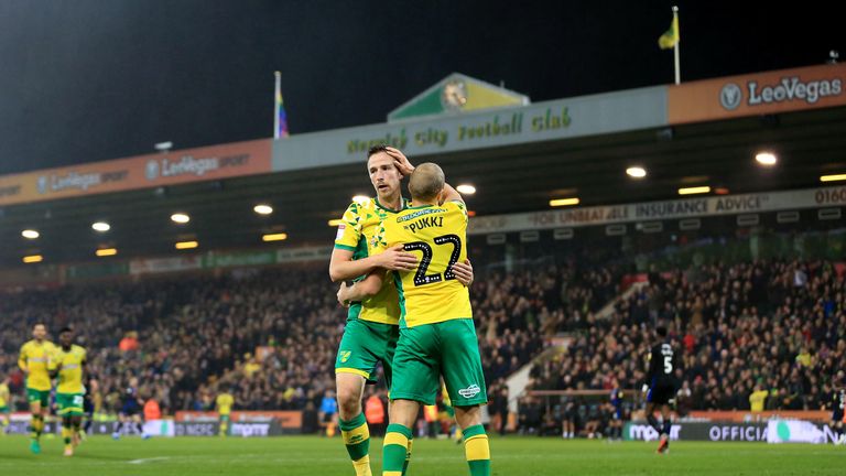 Teemu Pukki is congratulated after stretching Norwich's lead