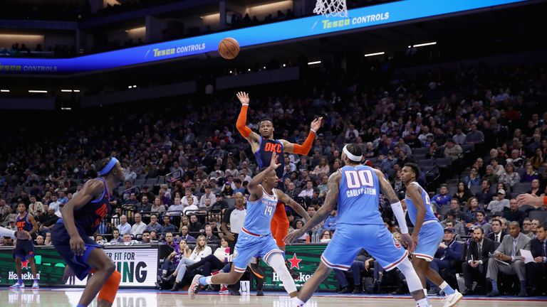 Russell Westbrook of the Oklahoma City Thunder throws an alley-oop pass to Jerami Grant against the Sacramento Kings
