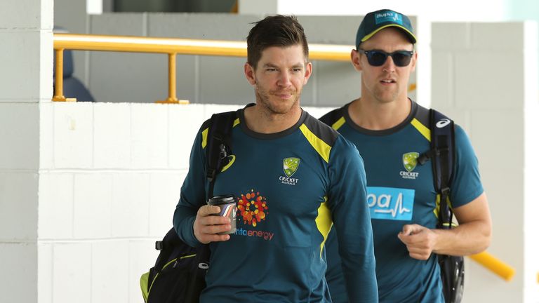 Australia captain Tim Paine arrives in Perth with strapping on his right index finger