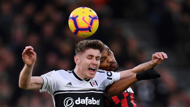 Tom Cairney and Steve Mouine compete for a header