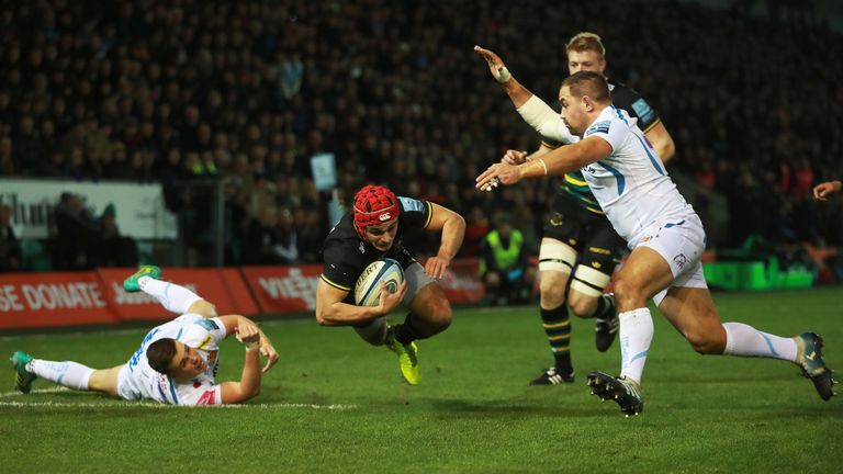 Tom Collins of Northampton Saints dives at the try line 