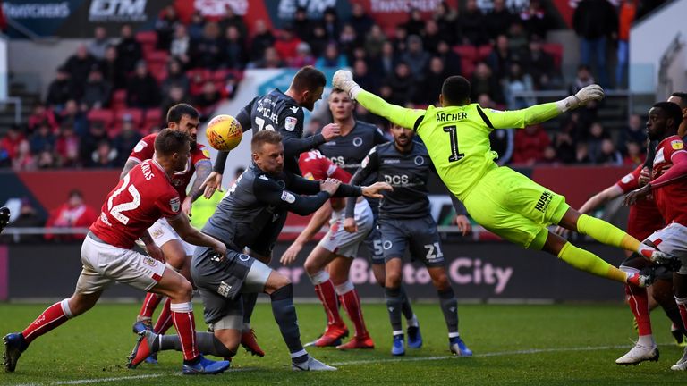 Tomas Kalas of Bristol City attempts to head the ball as Jordan Archer, Goalkeeper of Millwall attempts to save during the Sky Bet Championship match between Bristol City and Millwall at Ashton Gate on December 2, 2018 in Bristol, England.