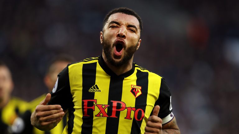 Troy Deeney celebrates after scoring from the penalty spot