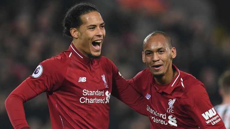 Liverpool's Virgil van Dijk and Fabinho celebrate after their win over Newcastle.
