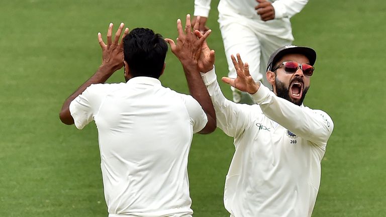 Kohli and Ravi Ashwin (L) celebrate India's victory