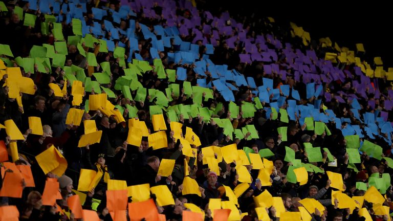 Watford fans hold up colours in support of the Stonewall charity's Rainbow Laces campaign before the Premier League match between Watford FC and Manchester City at Vicarage Road on December 04, 2018 in Watford, United Kingdom