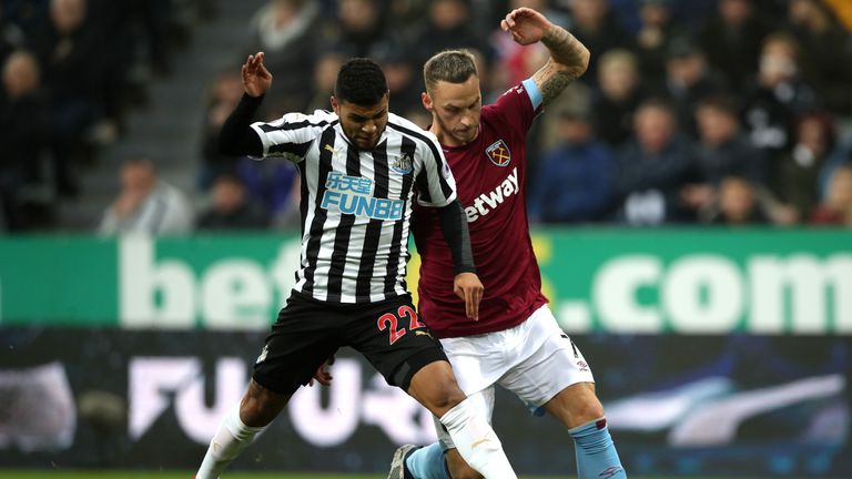 Newcastle's DeAndre Yedlin is challenged by Marko Arnautovic 