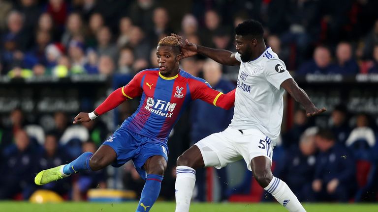 Wilfred Zaha is challenged by Bruno Ecuele