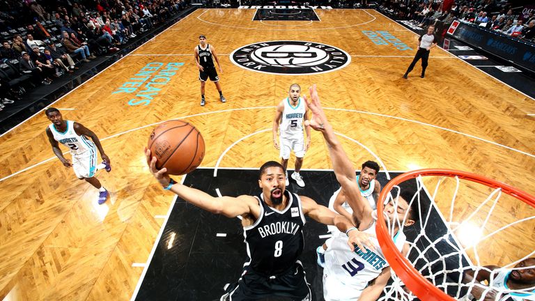 Spencer Dinwiddie scores at the rim against Charlotte