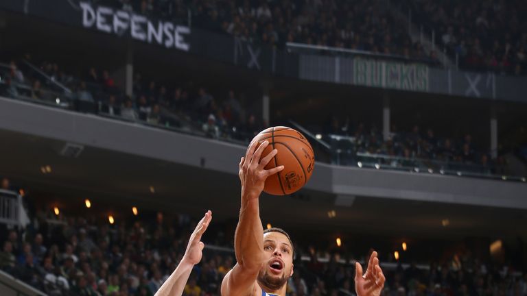 Stephen Curry rises to score against the Milwaukee Bucks