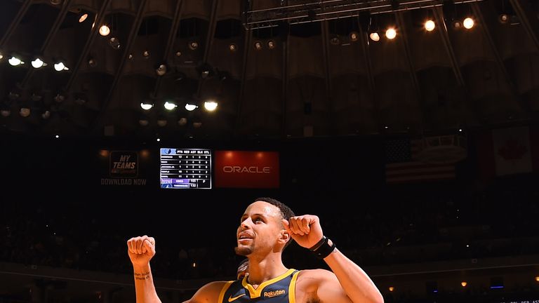 Stephen Curry celebrates after passes another scoring landmark against the Memphis Grizzlies