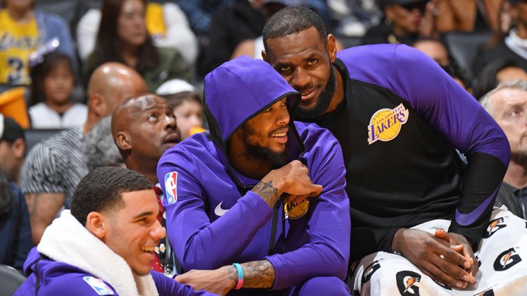 LeBron James photobombs Ingram on the Lakers' bench