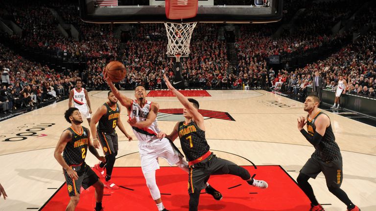 CJ McCollum charges towards the rim for a lay-up