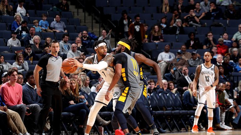 D'Angelo Russell protects the ball under pressure from Mike Conley