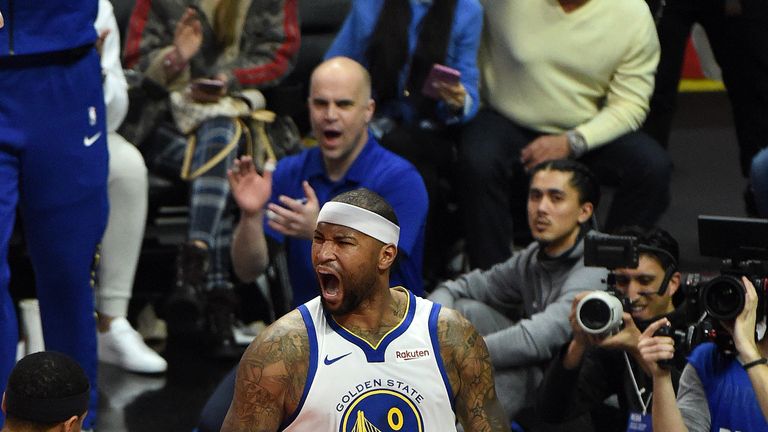 DeMarcus Cousins roars after scoring his first points as a Warrior
