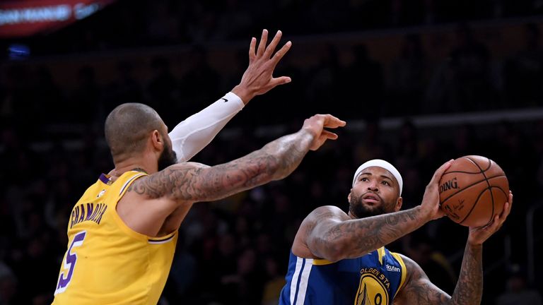 DeMarcus Cousins shoots over the top LA Lakers' Tyson Chandler